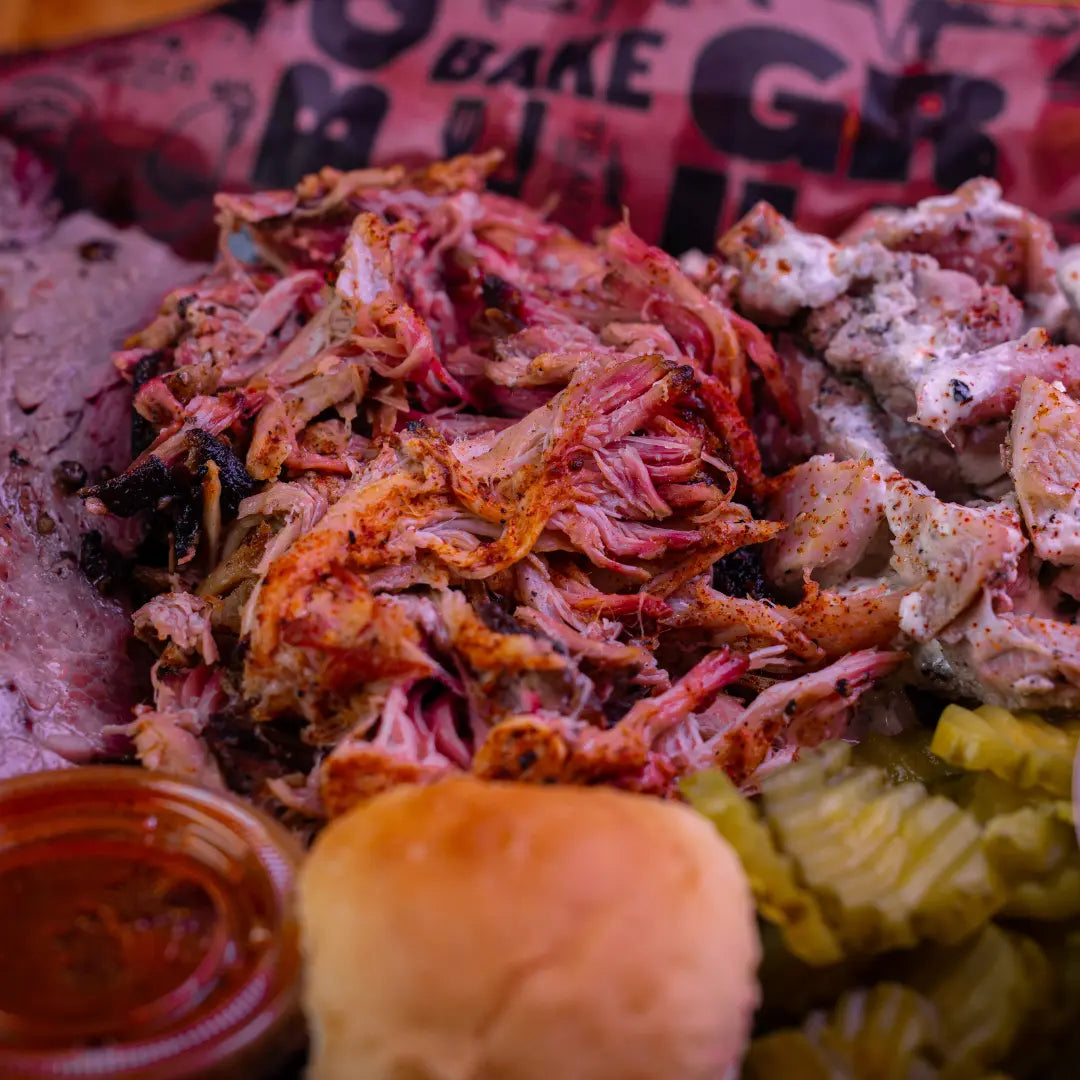 Three meat BBQ plate with brisket, ribs, and sides available for online pickup and delivery from Hoodidya BBQ in Redlands, California