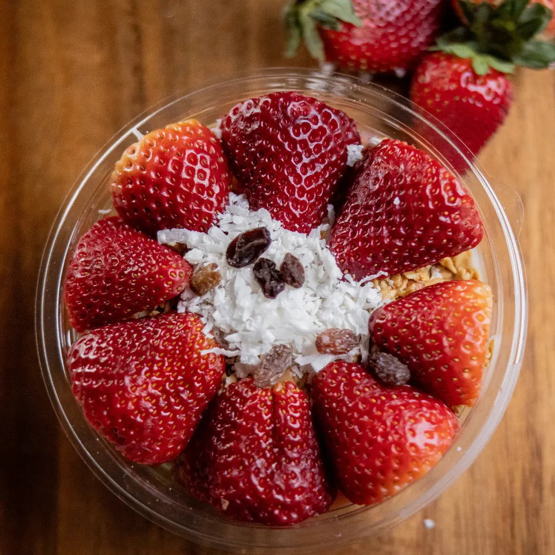 Bionico fruit bowl with fresh strawberries and coconut topping available for online pickup and delivery from Fresh Juiced Juice Bar in Redlands, California