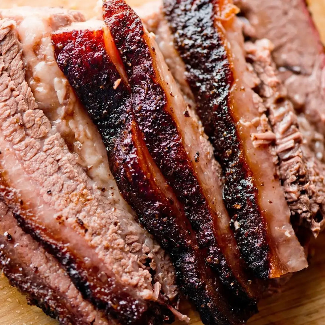 Sliced smoked brisket by the pound with bark and juicy interior available for online pickup and delivery from Hoodidya BBQ in Redlands, California