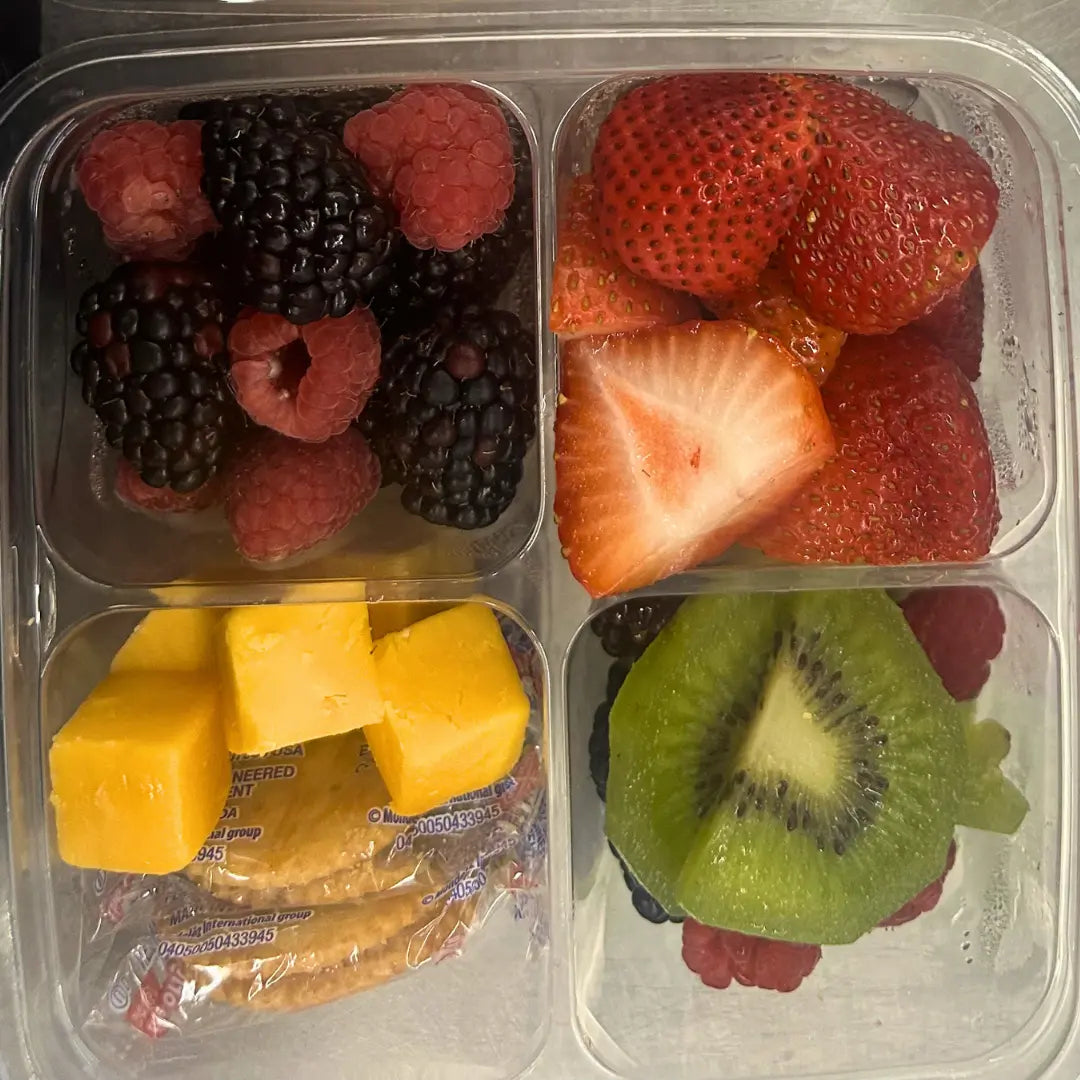 Grab and go lunch boxes with fruit, cheese, and snack items available for online pickup and delivery from Fresh Juiced Juice Bar in Redlands, California