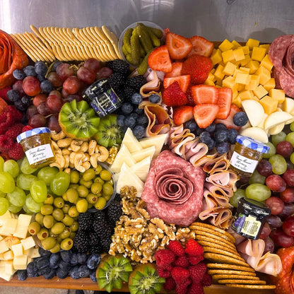 Gourmet charcuterie platter with assorted meats, cheeses, and fruit available for online pickup and delivery from Fresh Juiced Juice Bar in Redlands, California
