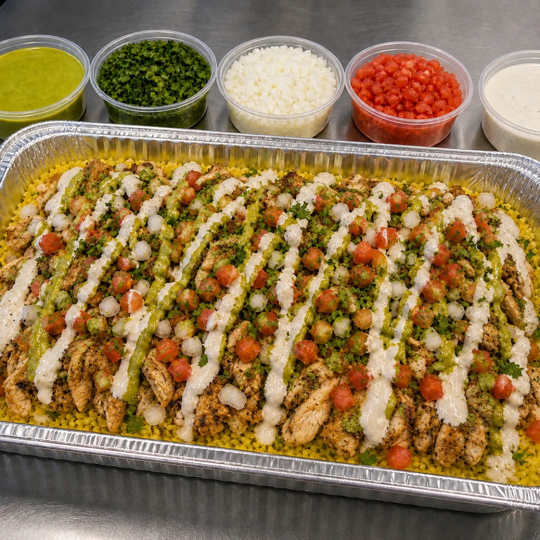 Chicken shawarma catering tray over rice with sauces and toppings available for online pickup and delivery from Redlands Ranch Market in Redlands, California

