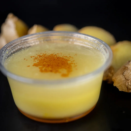 Fresh detox shot made with ginger, lemon, honey, and cayenne pepper available for online pickup and delivery from Fresh Juiced Juice Bar in Redlands, California
