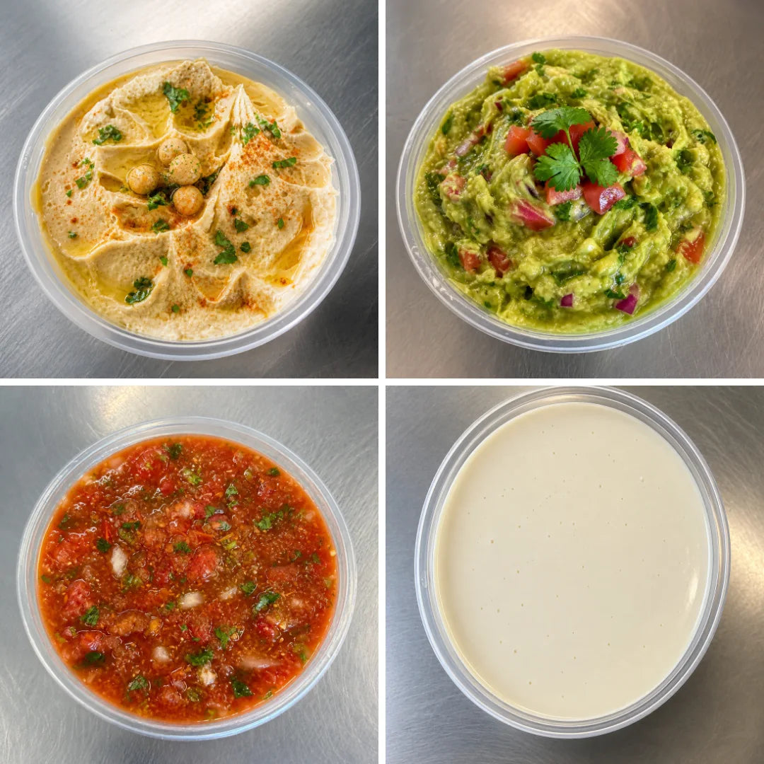 Four different types of dips in plastic containers on a metallic surface