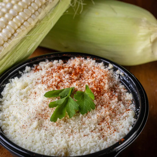Elotes esquites Mexican street corn cup topped with cheese and chili available for online pickup and delivery from Fresh Juiced Juice Bar in Redlands, California
