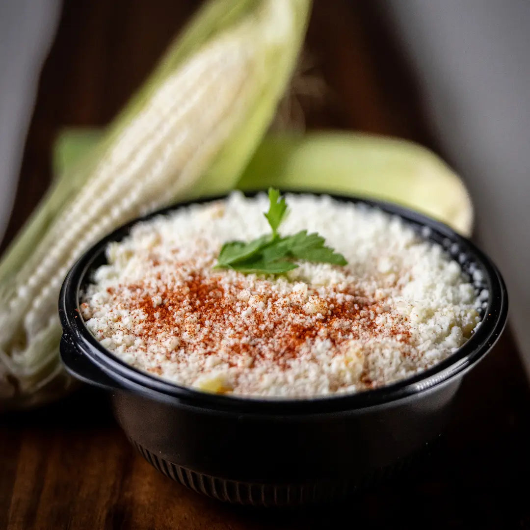Creamy esquites street corn cup with cheese topping available for online pickup and delivery from Fresh Juiced Juice Bar in Redlands, California
