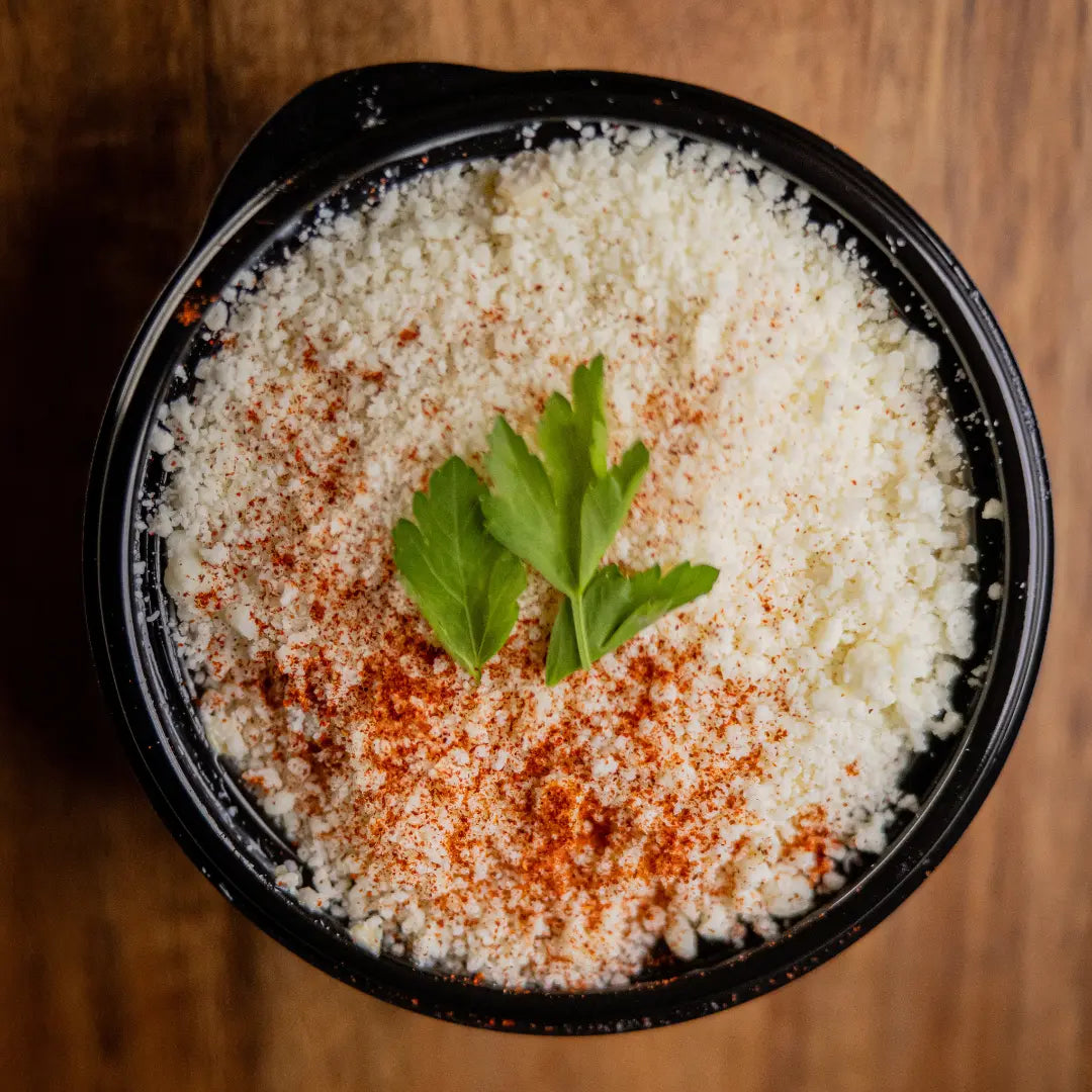Mexican street corn esquites cup with cotija cheese and seasoning available for online pickup and delivery from Fresh Juiced Juice Bar in Redlands, California