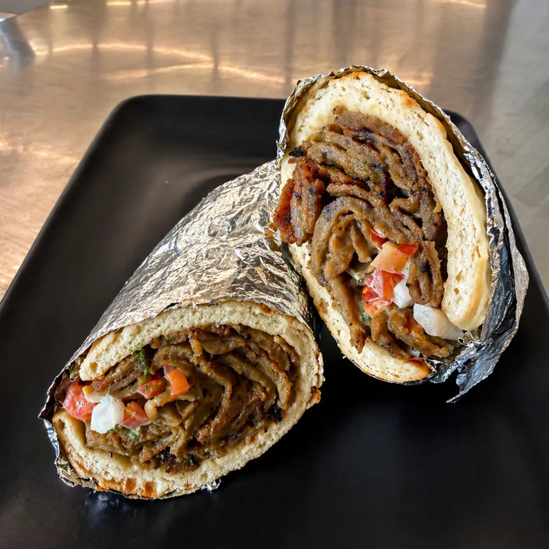 Halal beef and lamb gyro sandwich with white sauce available for online pickup and delivery from Redlands Ranch Market in Redlands, California
