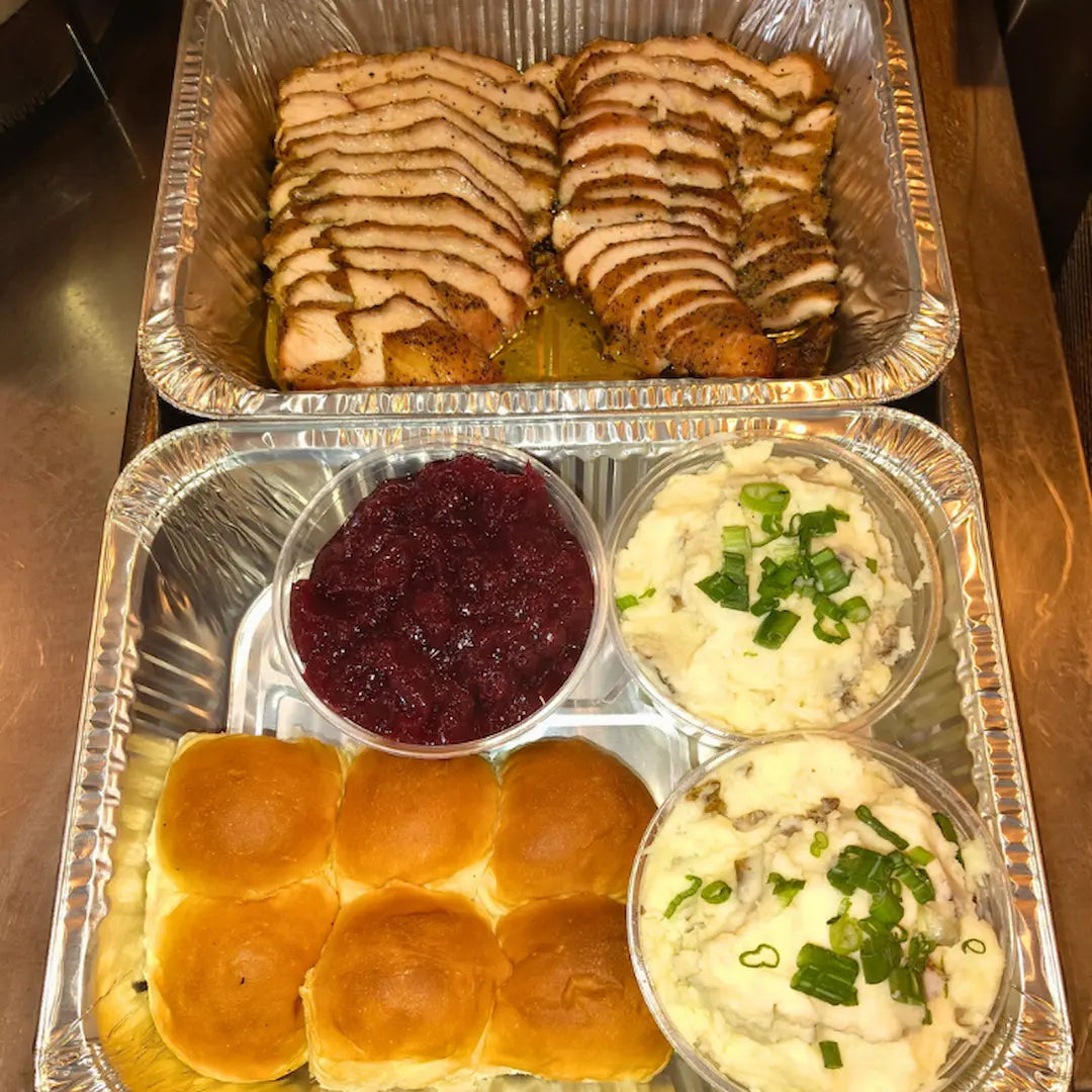 Holiday turkey dinner with smoked turkey, sides, and rolls available for online pickup and delivery from Hoodidya BBQ in Redlands, California