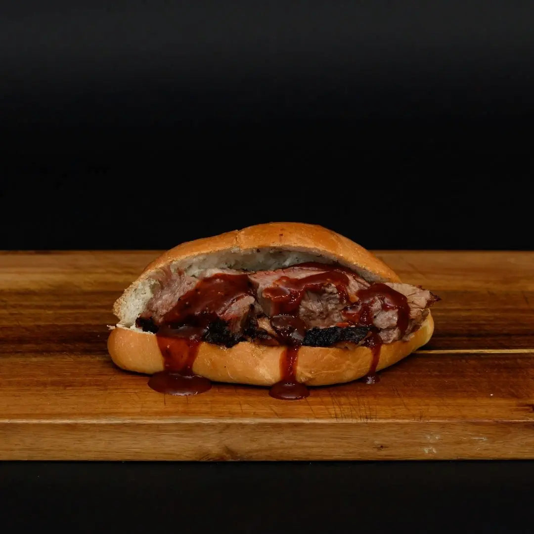 BBQ brisket sandwich on a soft roll available for online pickup and delivery from Hoodidya BBQ in Redlands, California
