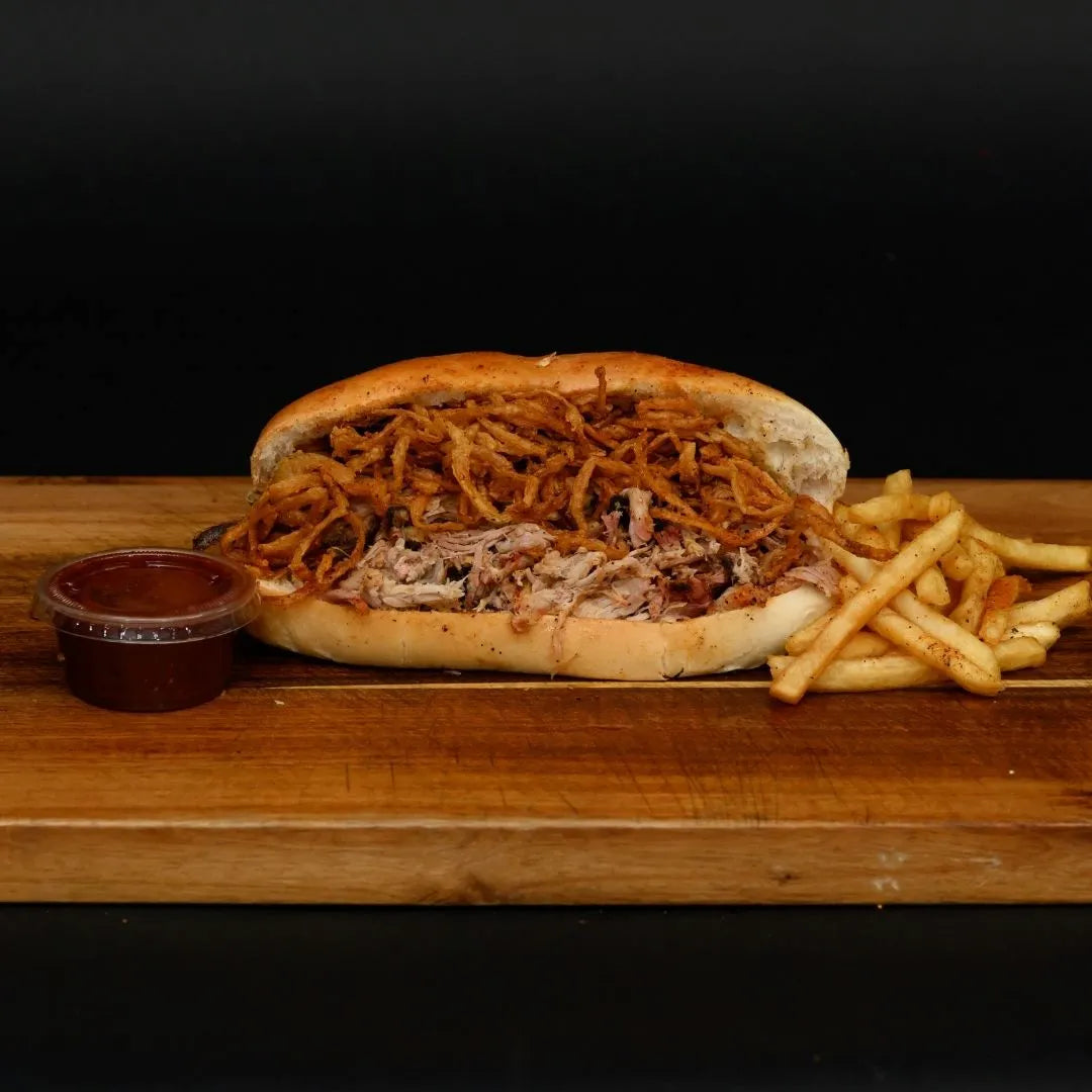 BBQ pulled pork sandwich on a soft roll available for online pickup and delivery from Hoodidya BBQ in Redlands, California