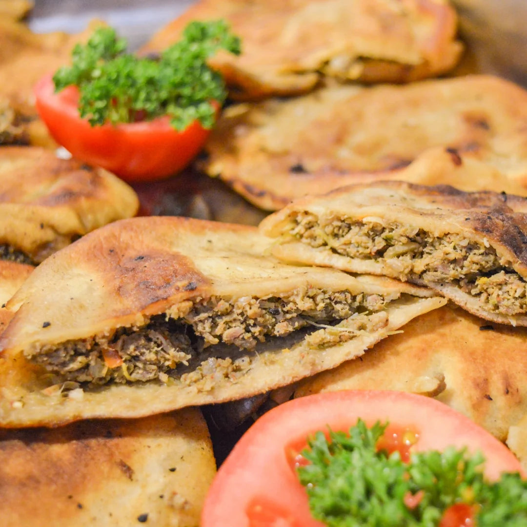 Egyptian hawawshi stuffed pizza with seasoned halal ground beef available for online pickup and delivery from Redlands Ranch Market in Redlands, California