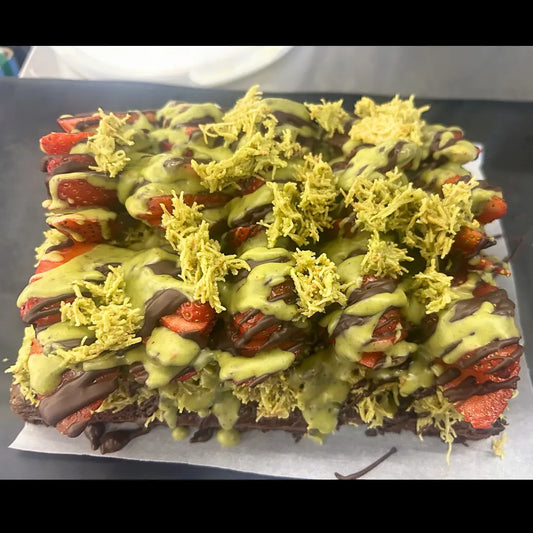 Strawberry Dubai 1/8 sheet cake topped with fresh strawberries, chocolate drizzle, and pistachio cream available for online pickup and delivery from Fresh Juiced Juice Bar in Redlands, California
