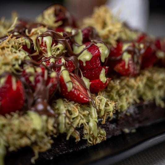Strawberry Dubai brownie topped with pistachio cream and chocolate available for online pickup and delivery from Fresh Juiced Juice Bar in Redlands, California
