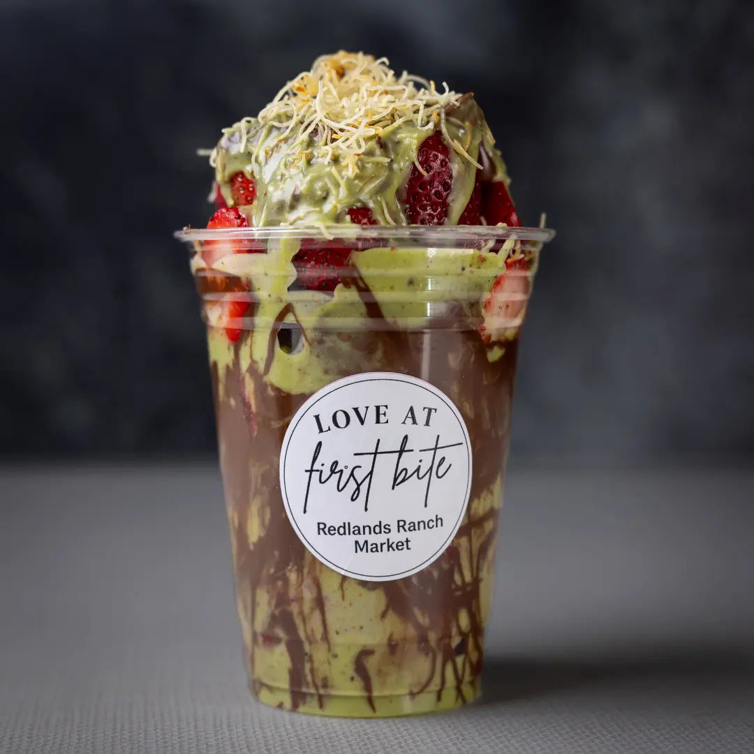 Strawberry dessert cup with pistachio cream and chocolate drizzle available for online pickup and delivery from Fresh Juiced Juice Bar in Redlands, California

