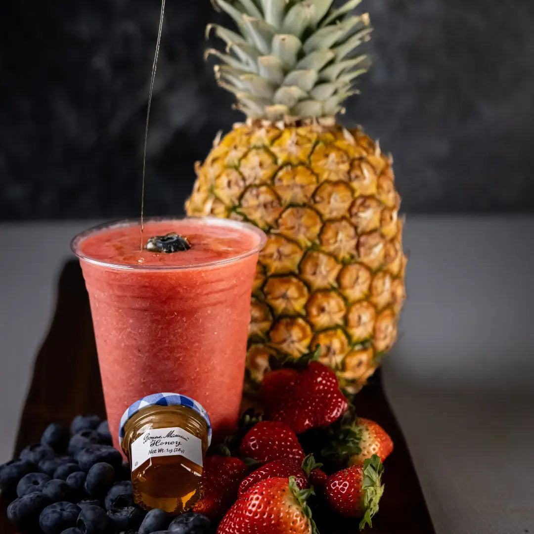 The Islander smoothie blended with tropical fruit available for online pickup and delivery from Fresh Juiced Juice Bar in Redlands, California
