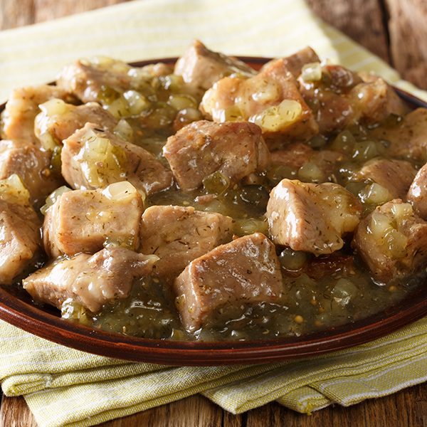 Pork slowly stews with jalapenos, onion, green verde sauce and s