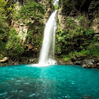 Majestic waterfall in the rainforest jungle of Costa Rica.  La Cangreja waterfall in Rincon de La Vieja National Park, Guanacaste